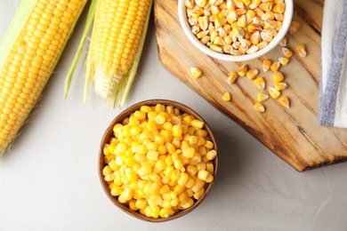 Photo of Flat lay composition with corn kernels on grey background