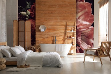 Image of Stylish room interior with furniture, bathtub and beautiful floral wallpapers