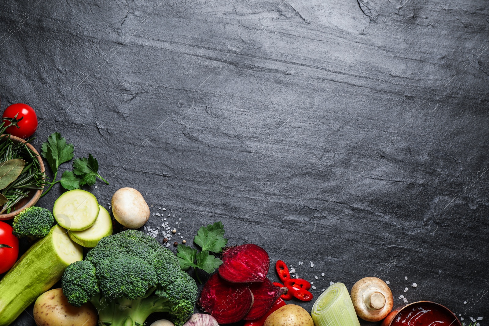 Photo of Flat lay composition with fresh products on grey table, space for text. Healthy cooking