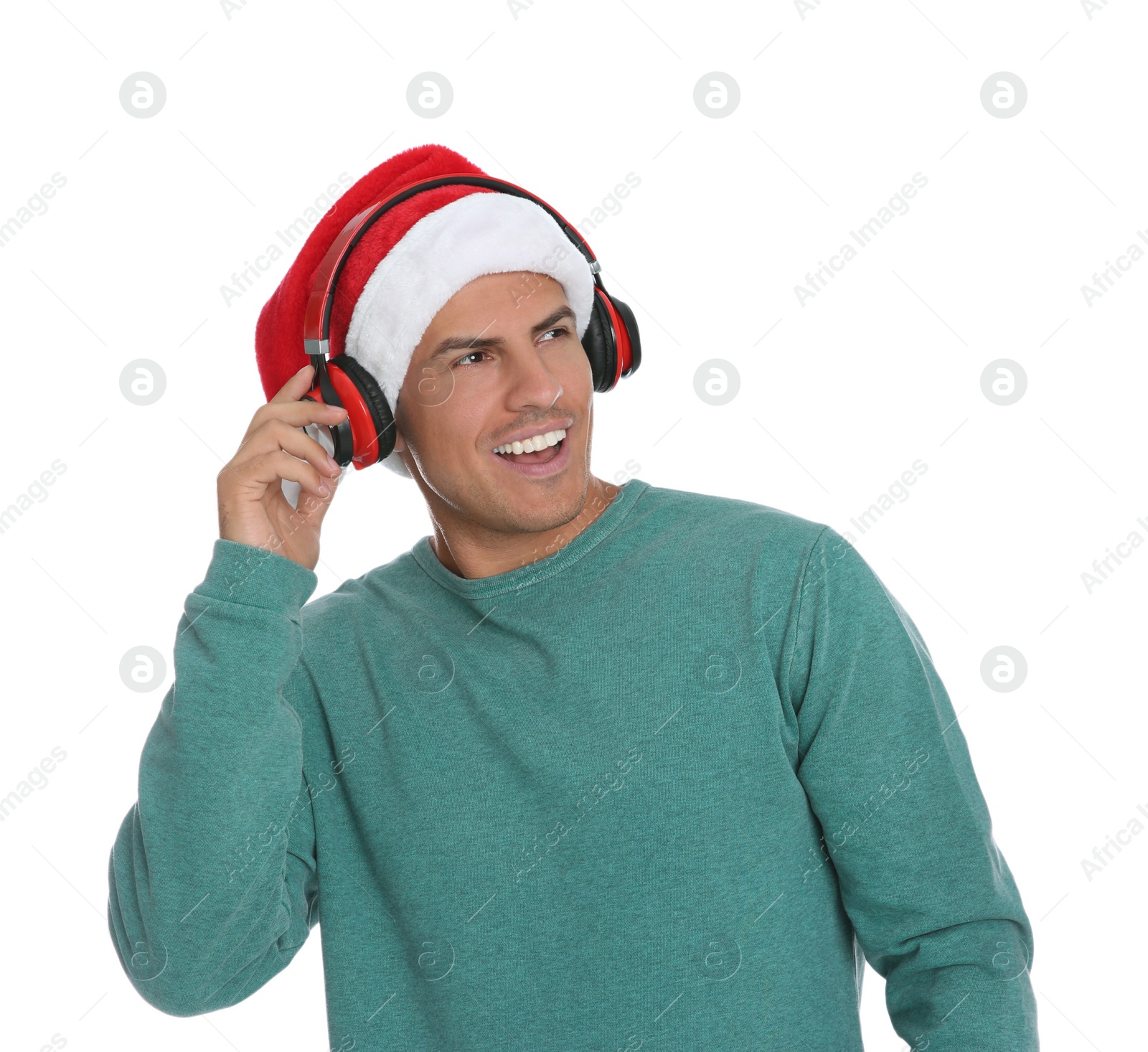 Photo of Happy man with headphones on white background. Christmas music