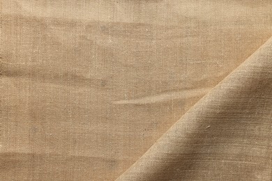 Photo of Texture of burlap fabric as background, top view