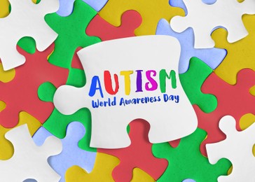 World Autism Awareness Day. Many colorful puzzle pieces, top view