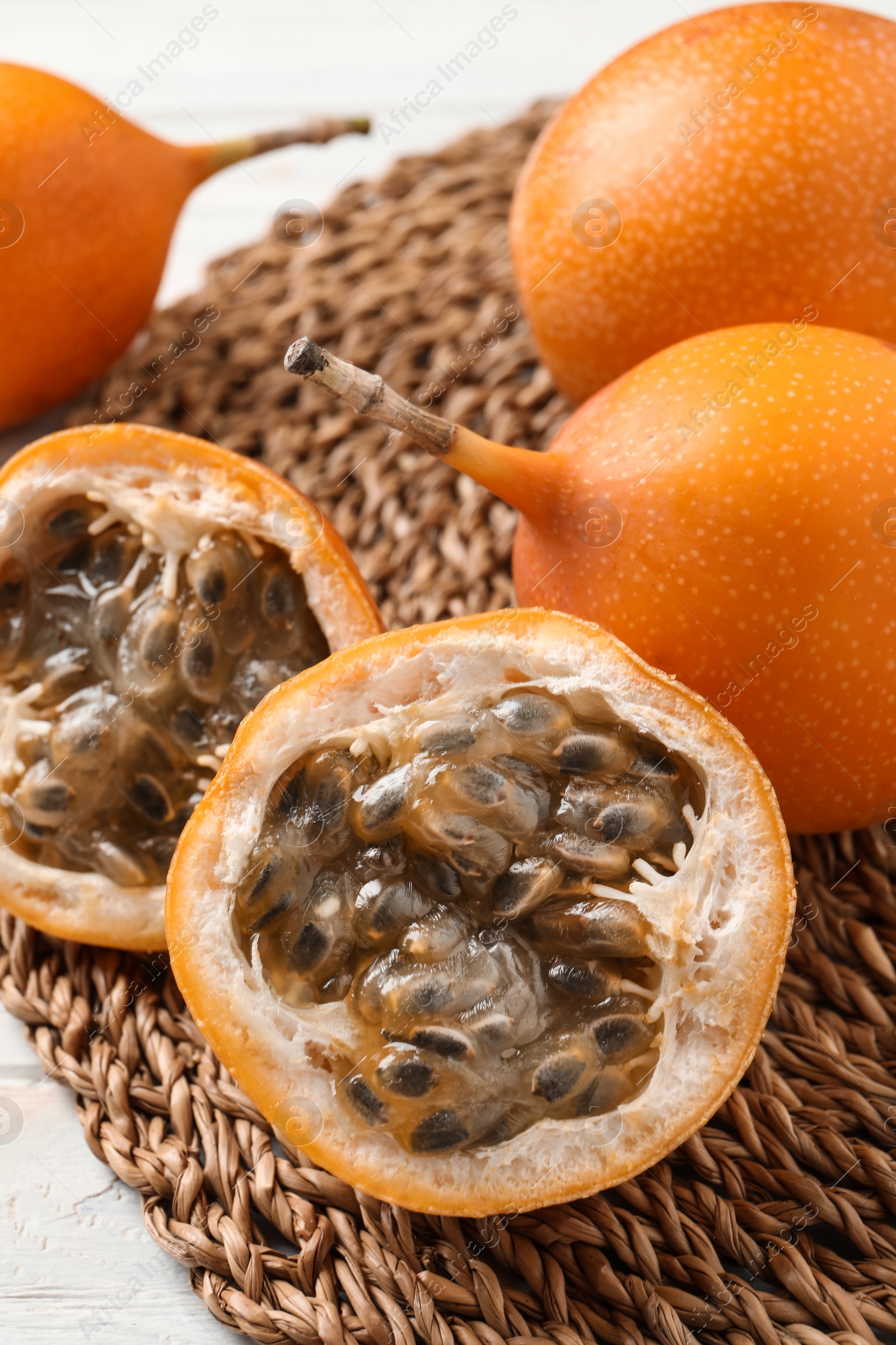 Photo of Delicious ripe granadillas on table, closeup view