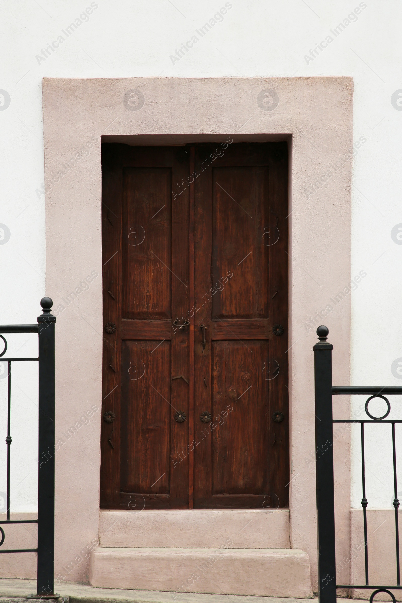 Photo of Entrance of residential house with wooden door