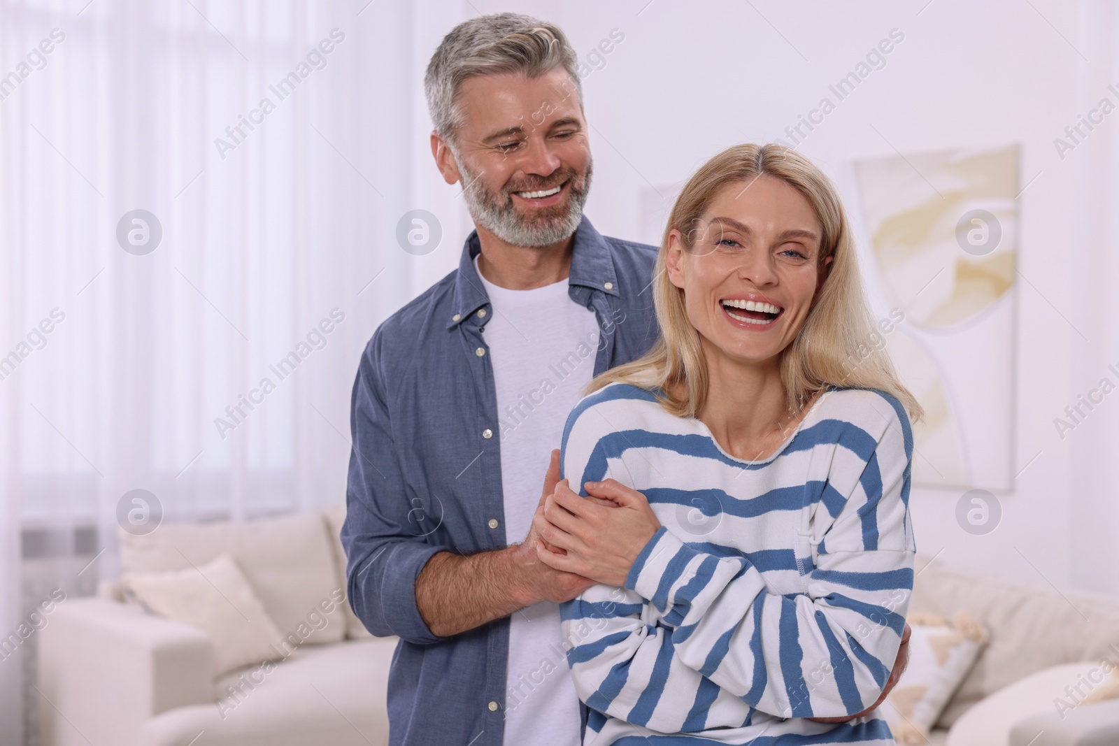 Photo of Portrait of happy affectionate couple at home. Romantic date