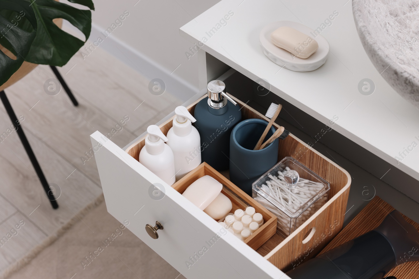 Photo of Different bath accessories and personal care products in drawer indoors