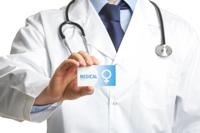 Photo of Gynecologist holding business card isolated on white, closeup. Medical service