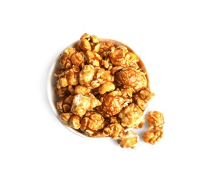 Photo of Delicious popcorn with caramel in paper bucket on white background