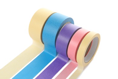 Many different rolls of adhesive tape on white background