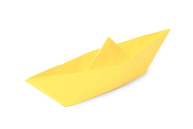 Photo of Yellow paper boat isolated on white. Origami art