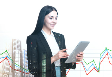 Image of Double exposure of businesswoman with tablet and cityscape. Forex trading