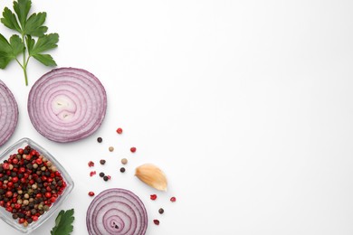 Fresh red onions, garlic, parsley and spices on white background, flat lay. Space for text