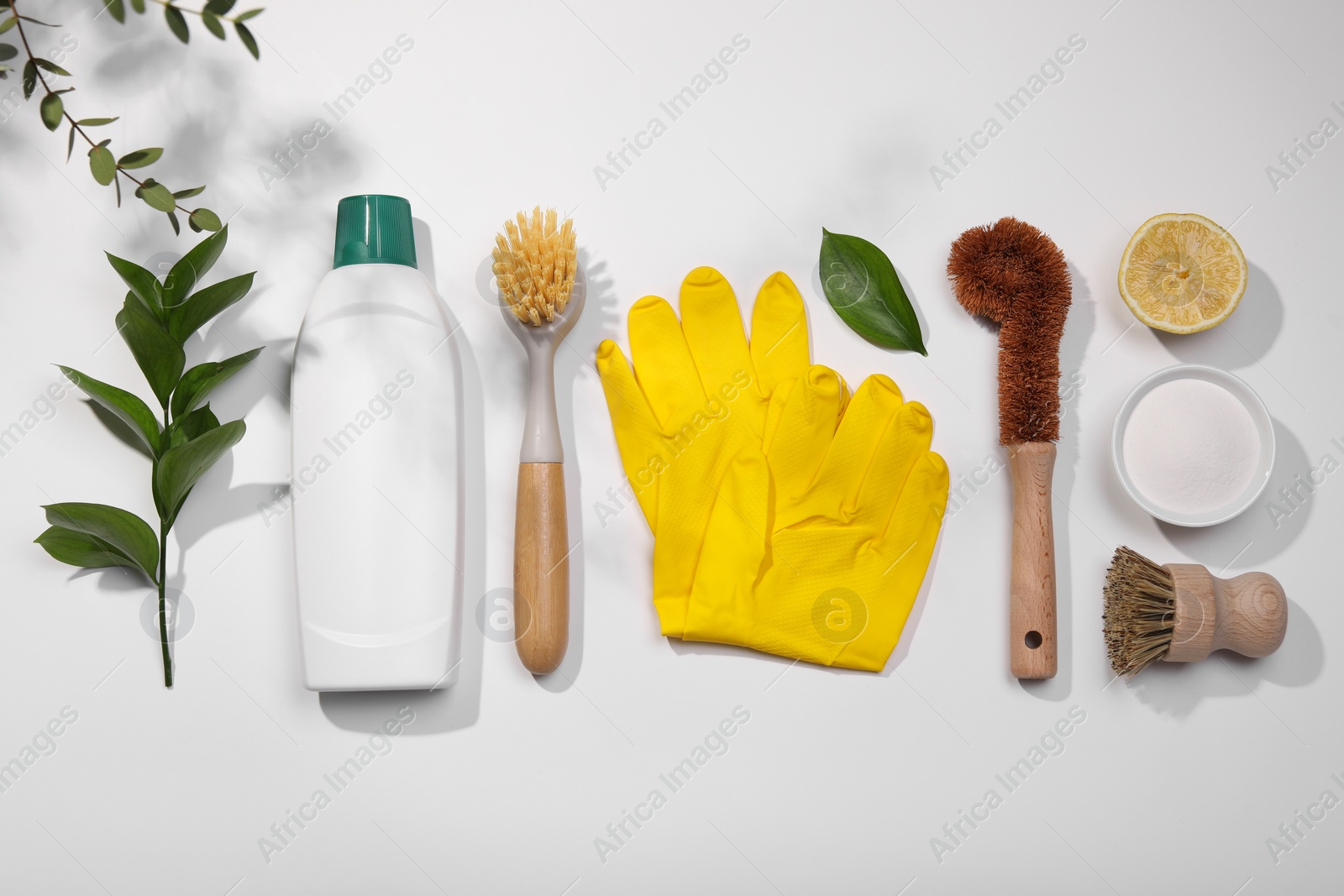 Photo of Flat lay composition with different cleaning supplies on white background