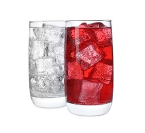 Photo of Glasses of different refreshing soda water with ice cubes isolated on white