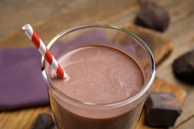 Photo of Delicious chocolate milk in glass, closeup view