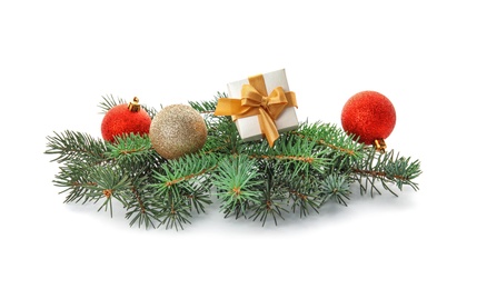 Photo of Branches of Christmas tree with decorations on white background