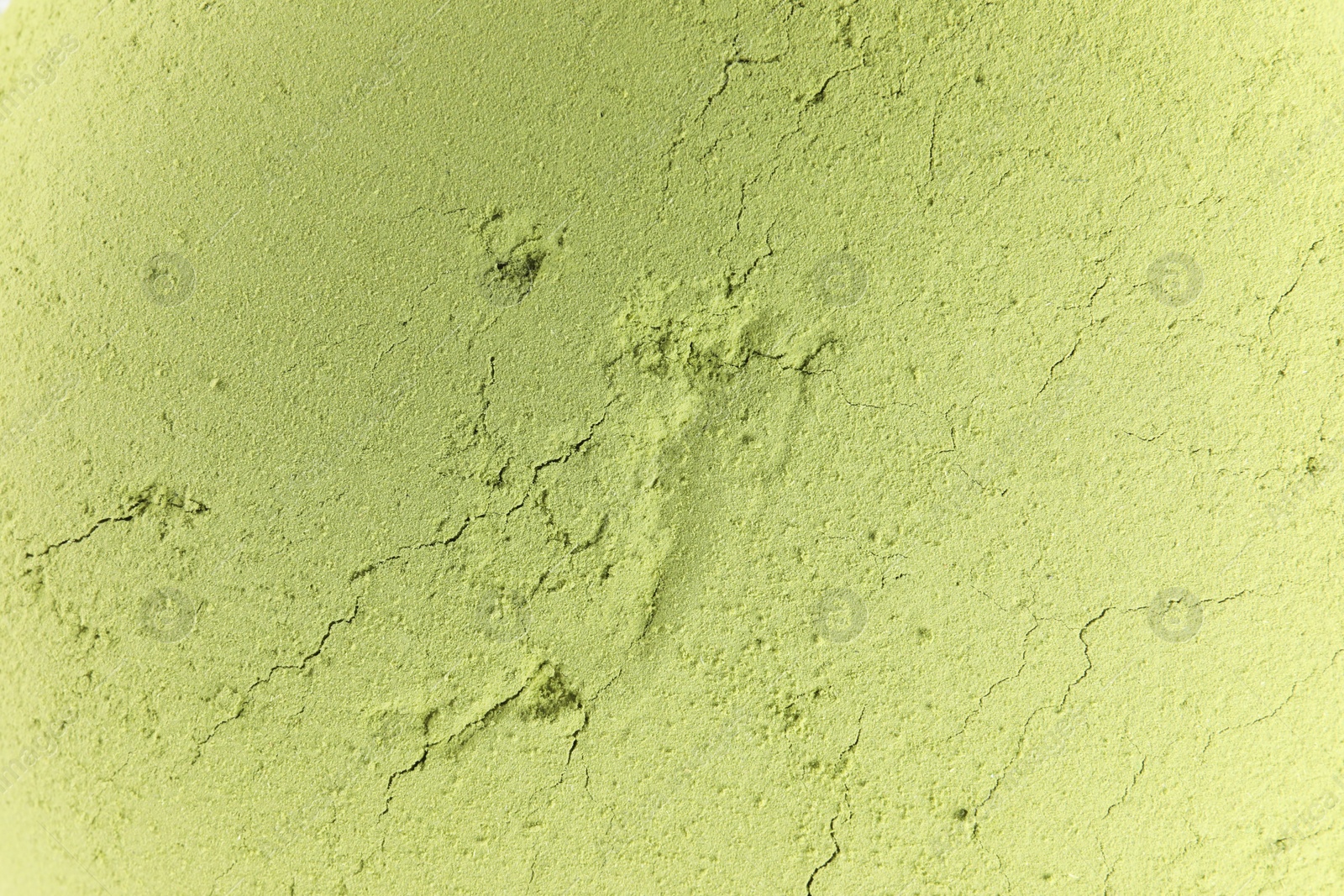 Photo of Green matcha powder as background, top view