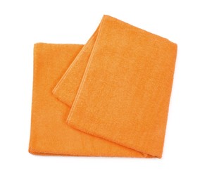 Photo of Folded orange beach towel isolated on white, top view