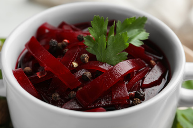 Delicious pickled beets in bowl, closeup view