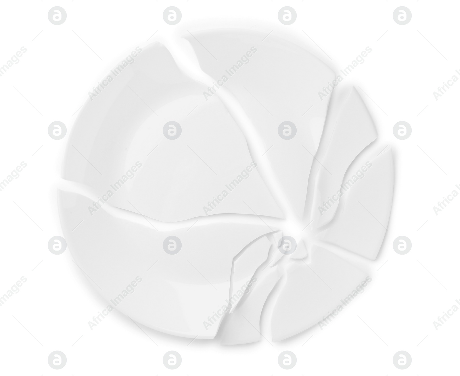 Photo of Pieces of broken ceramic plate on white background, top view