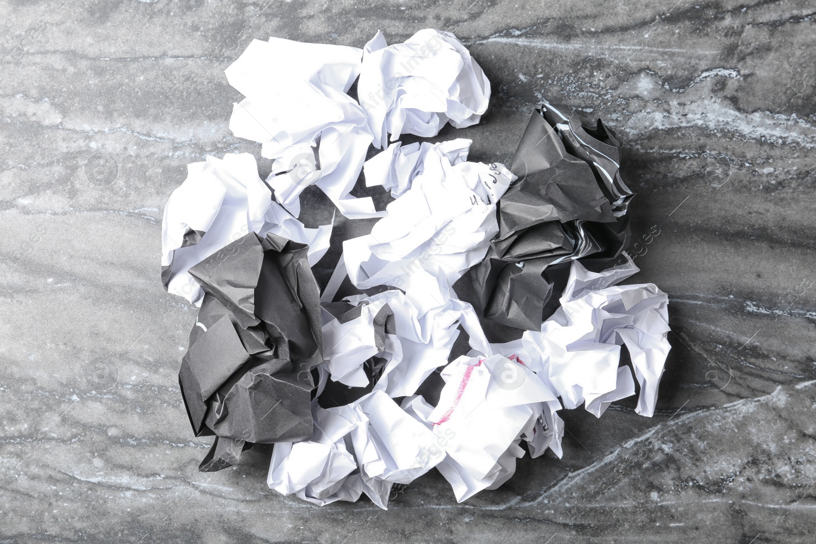 Photo of Pile of crumpled paper on grey background, top view. Recycling problem