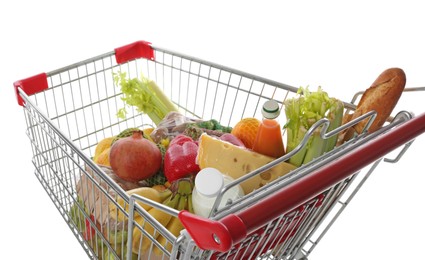 Photo of Shopping cart with fresh groceries on white background