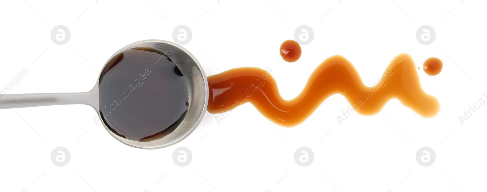 Photo of Tasty soy sauce and spoon isolated on white, top view