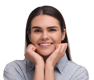 Young woman with clean teeth smiling on white background