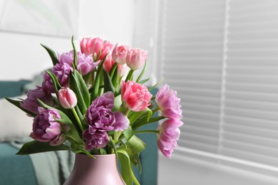 Photo of Beautiful bouquet of colorful tulip flowers indoors. Space for text