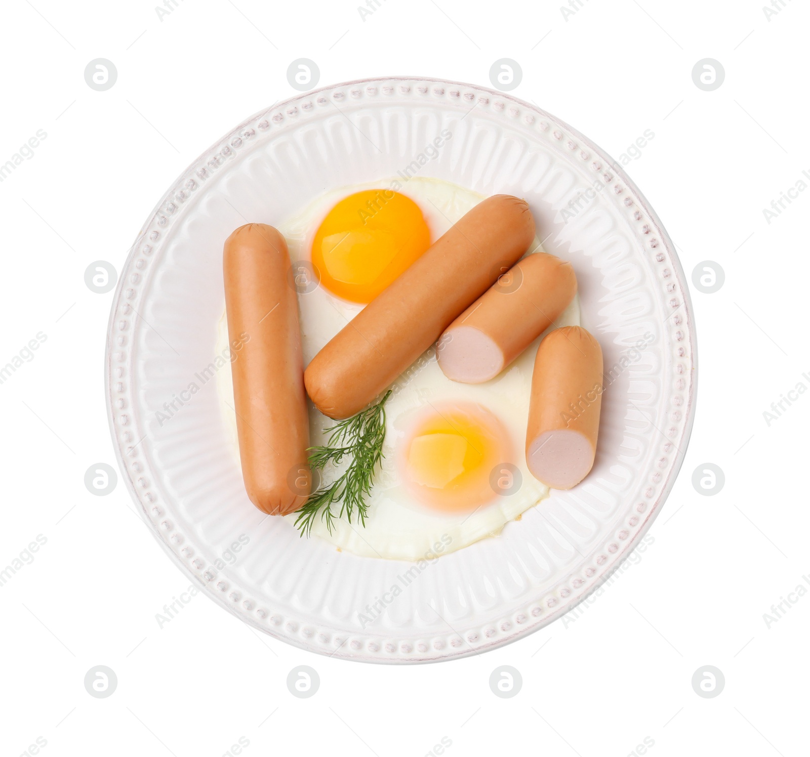 Photo of Delicious boiled sausages, fried eggs and dill isolated on white, top view