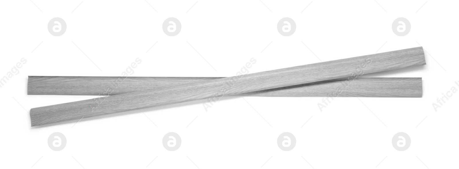 Photo of Two pieces of wooden baseboards isolated on white, top view