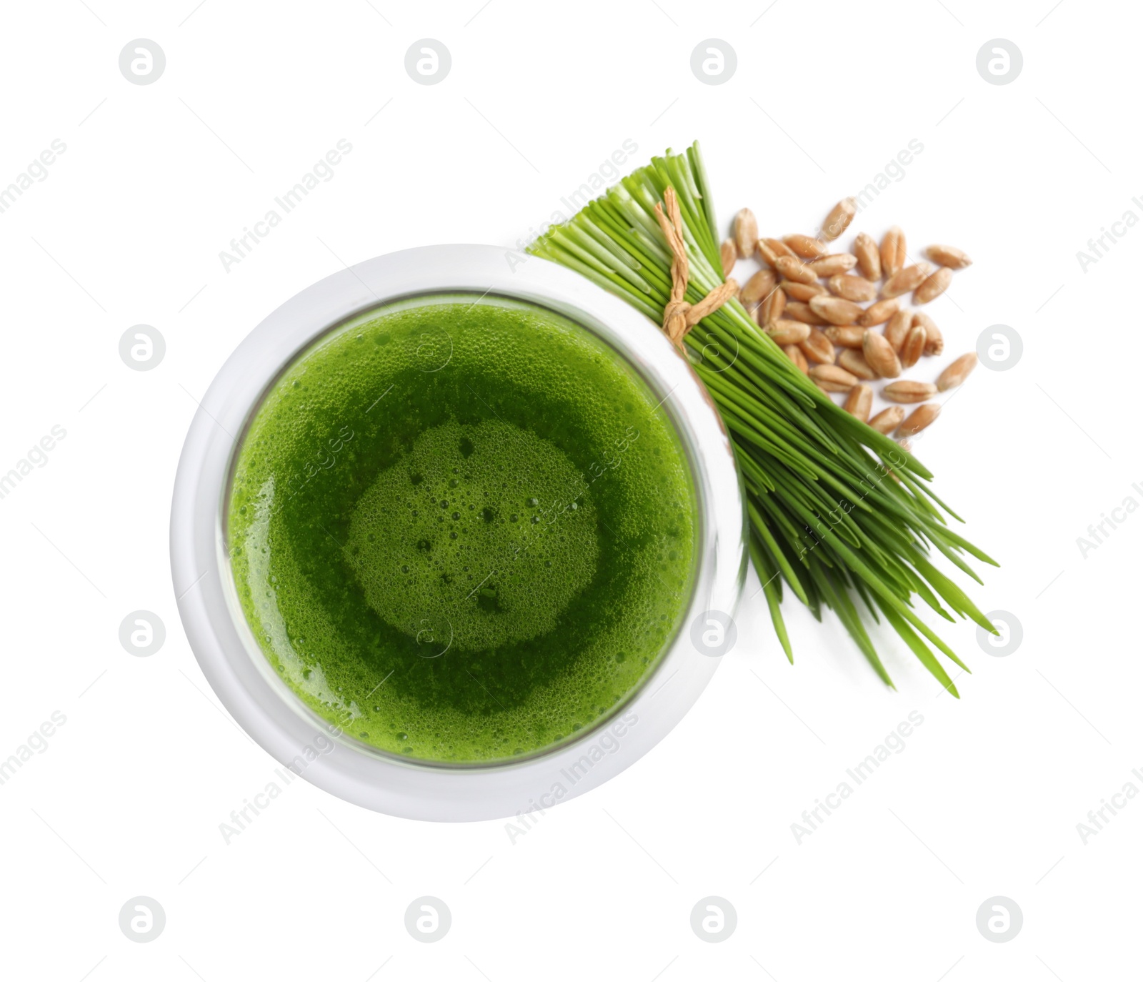 Photo of Glass of fresh wheat grass juice, seeds and sprouts on white background, top view