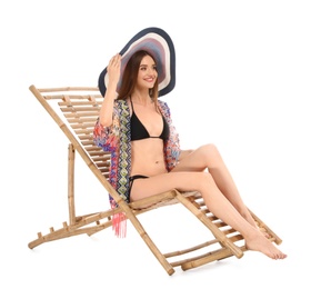 Photo of Young woman on sun lounger against white background. Beach accessories