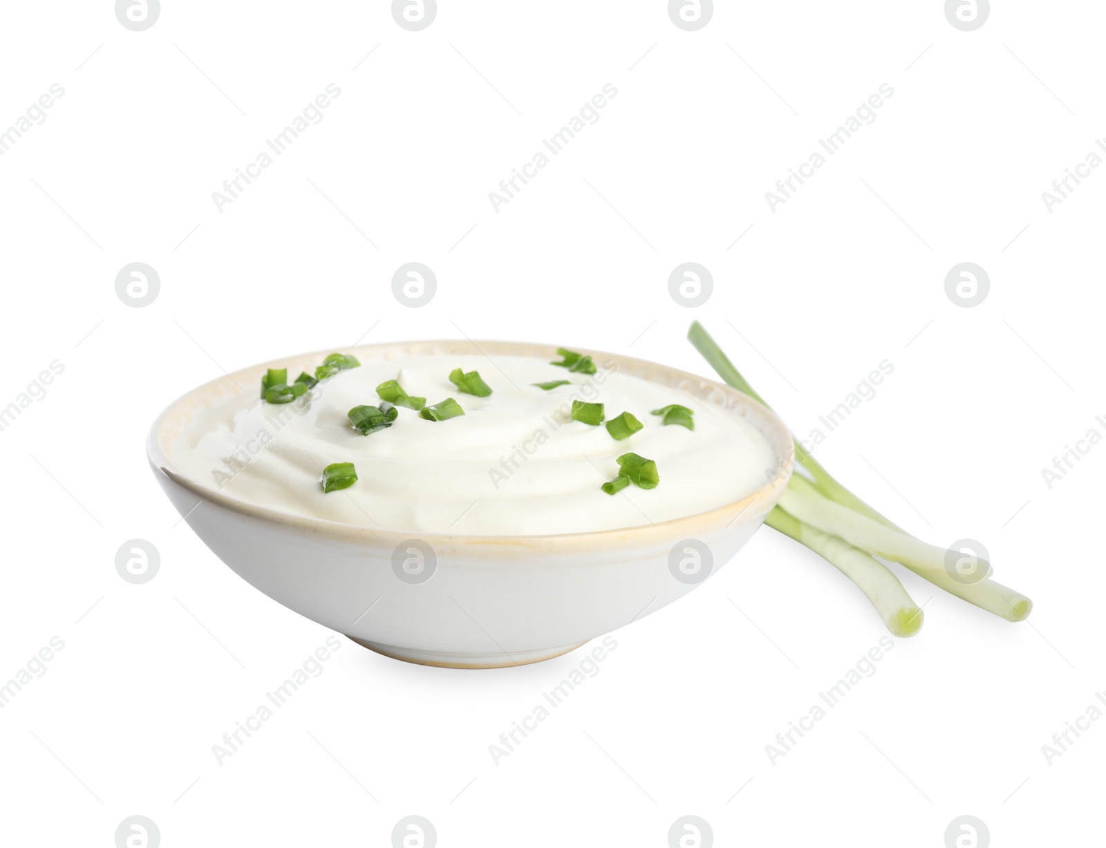 Photo of Fresh sour cream with onion on white background