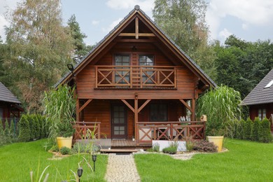 Photo of Exterior of beautiful wooden summer house with porch