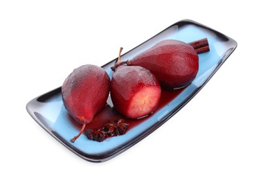 Tasty red wine poached pears and spices isolated on white