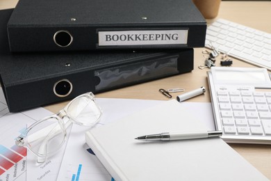 Bookkeeper's workplace with folders and documents on table