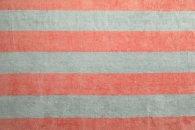 Photo of Striped beach towel as background, top view