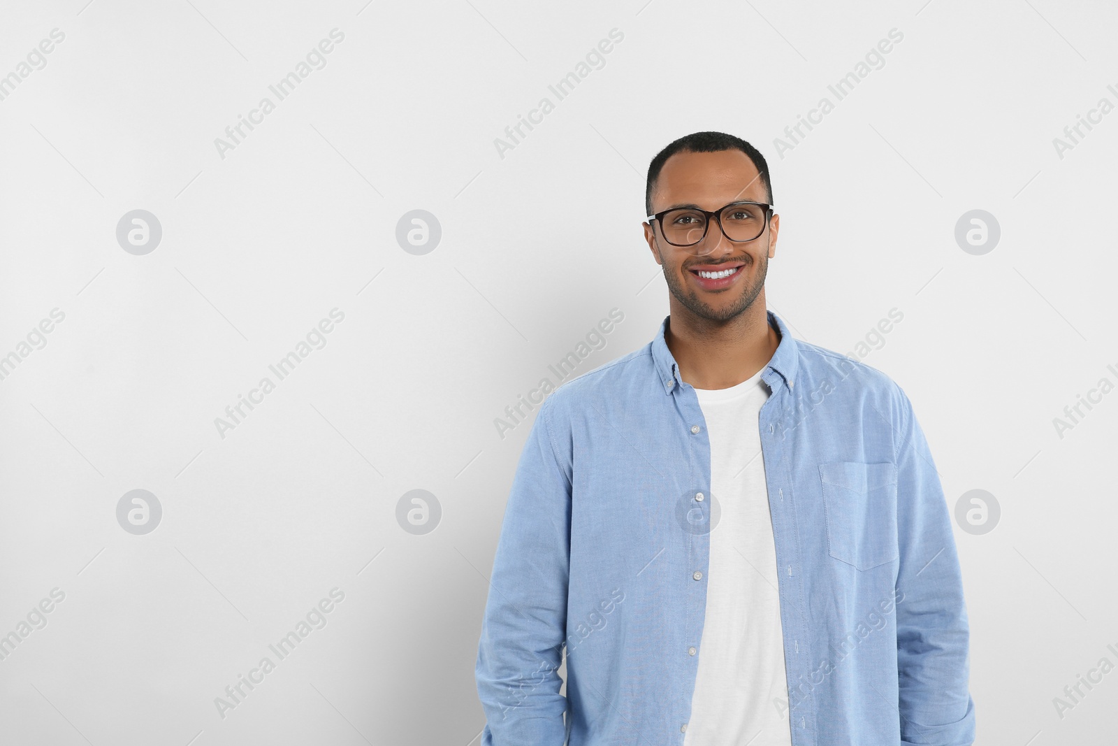 Photo of Portrait of handsome young man on white background, space for text