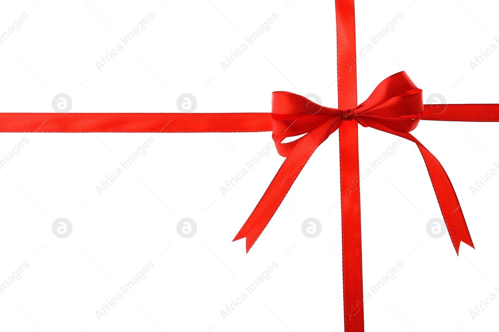 Photo of Red ribbon with bow on white background. Festive decoration