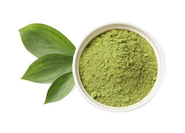 Photo of Henna powder in bowl and green leaves isolated on white, top view