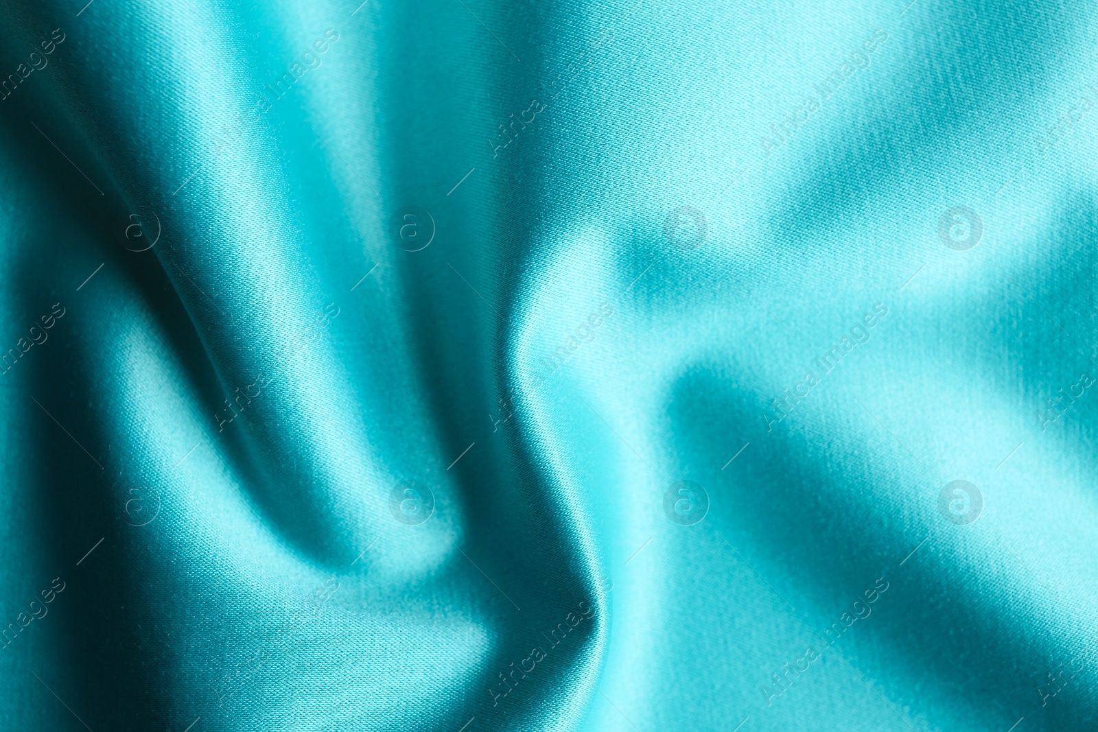 Photo of Texture of delicate blue fabric as background, closeup