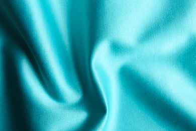 Photo of Texture of delicate blue fabric as background, closeup