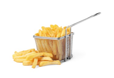 Photo of Delicious French fries and metal basket isolated on white
