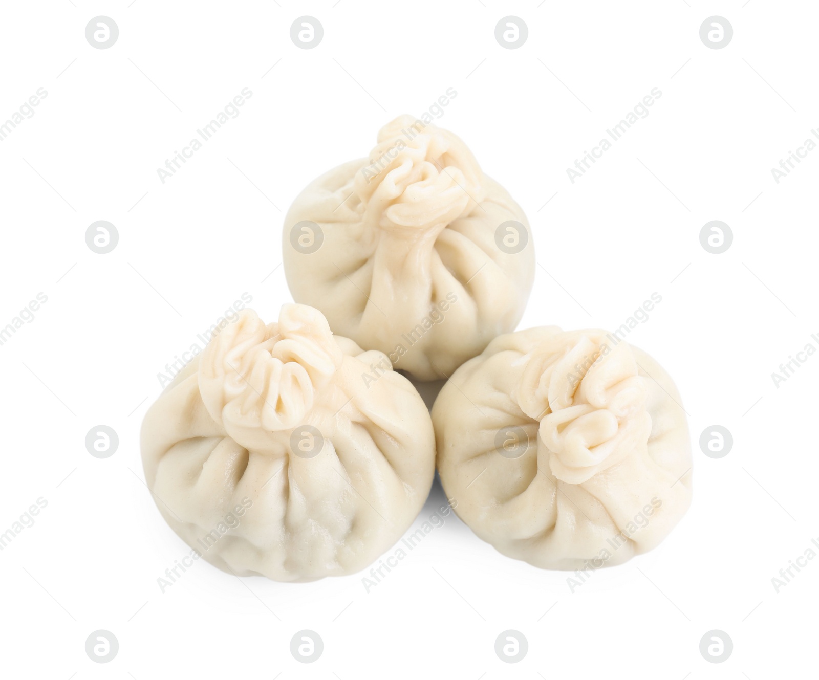 Photo of Three tasty khinkali (dumplings) isolated on white, top view. Georgian cuisine