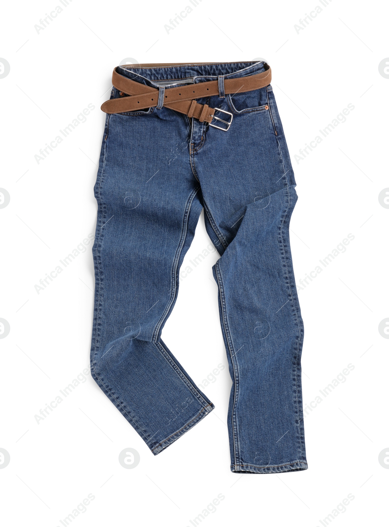 Photo of Rumpled dark blue jeans isolated on white, top view. Stylish clothes