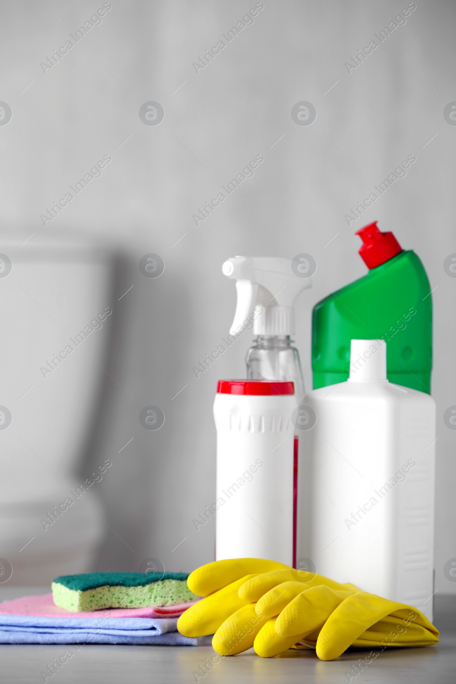 Photo of Set of cleaning supplies on table indoors