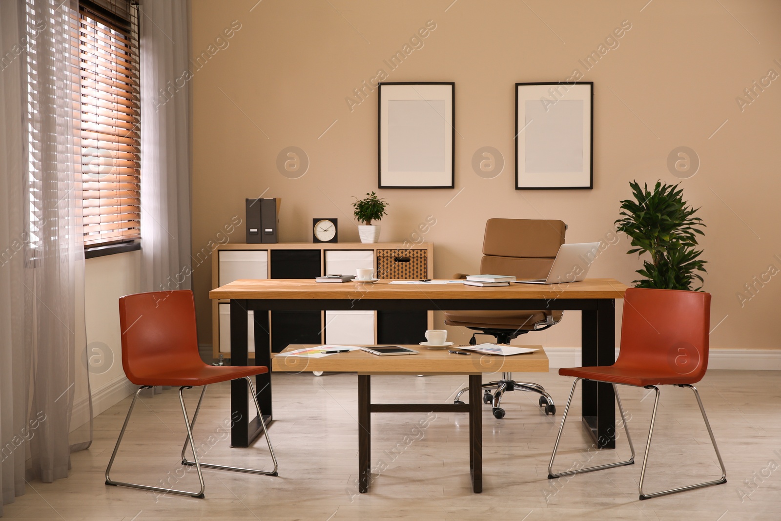 Photo of Director's office with large wooden table. Interior design