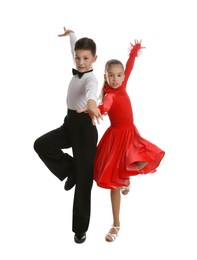 Beautifully dressed couple of kids dancing on white background