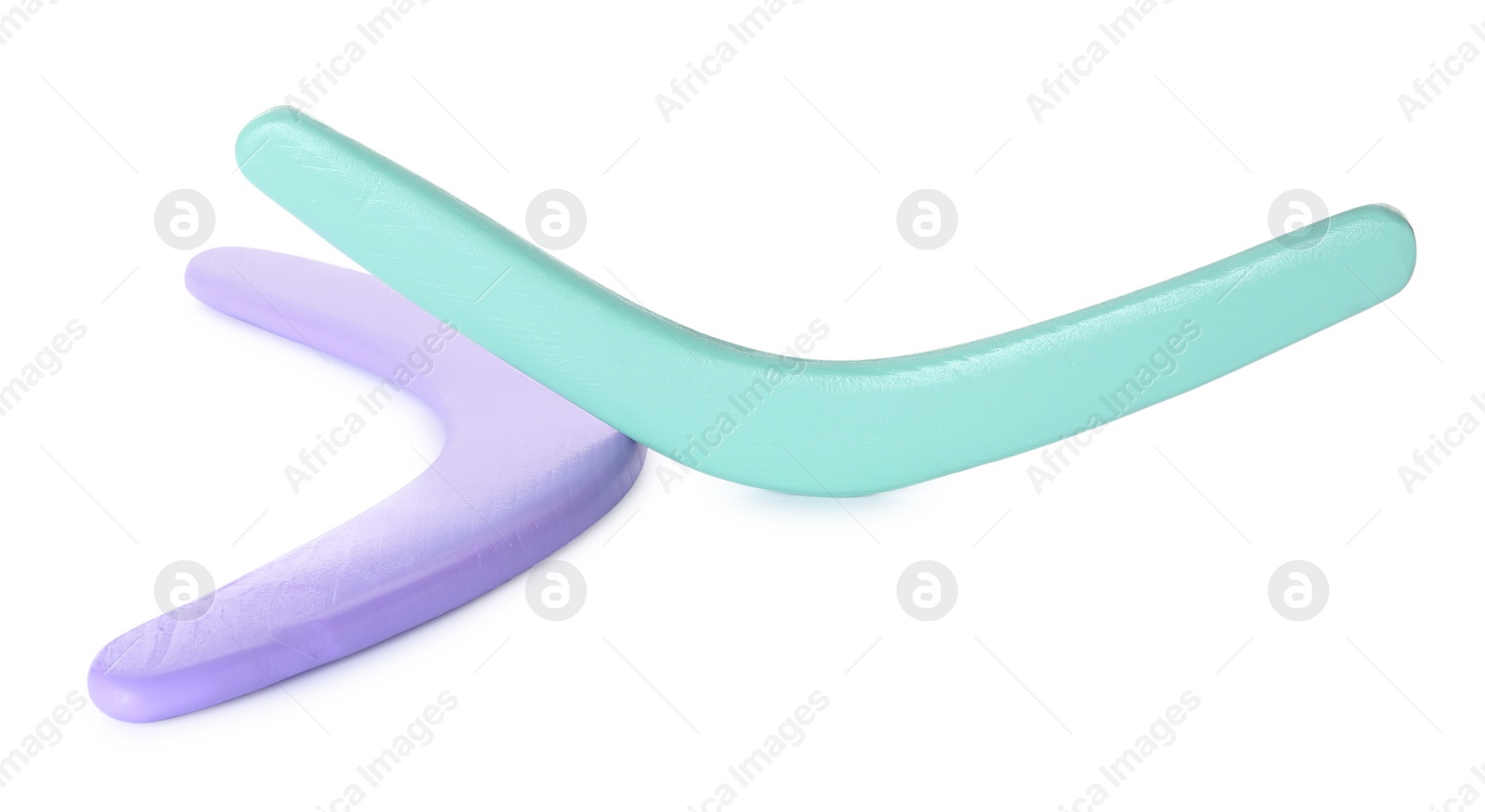 Photo of Purple and turquoise boomerangs on white background